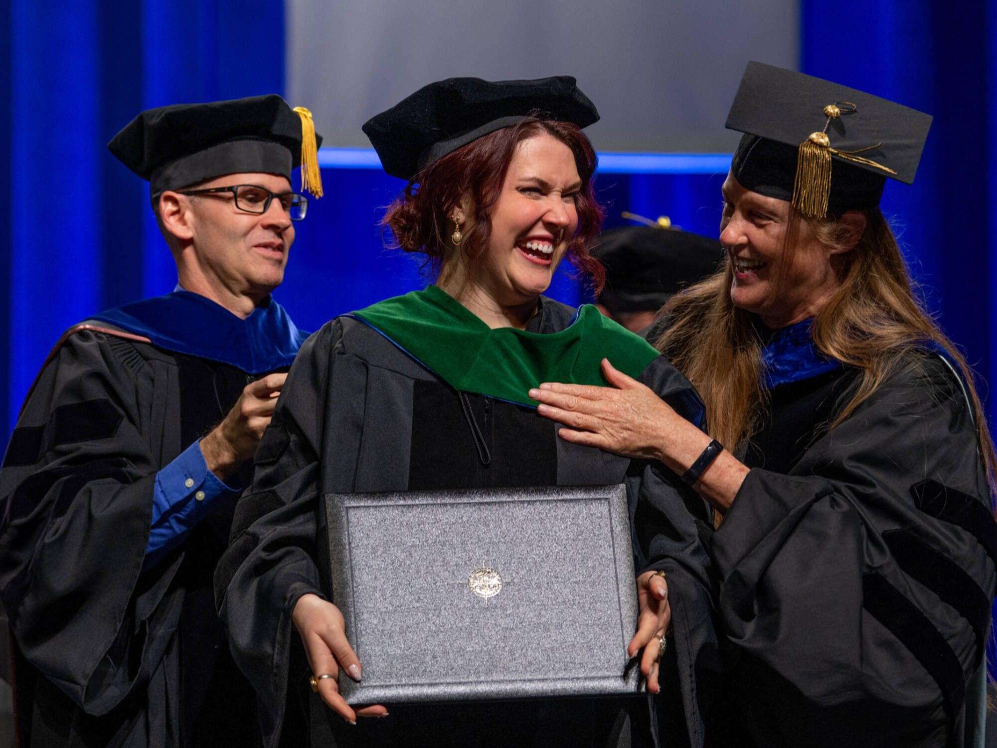 3 Student in regalia at a graduation ceremony